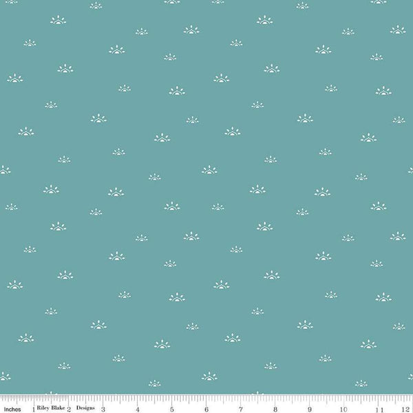 Image of the Winged Medley Woodblock Teal quilting cotton fabric. Features suns on a teal background. Cute Little Fabric Shop