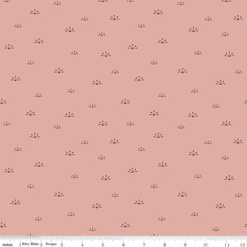 Image of the Winged Medley Woodblock Dusty Rose quilting cotton fabric. Features suns on a coral background. Cute Little Fabric Shop