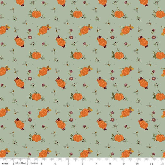 Image of the Awe of Autumn Pumpkins Hazy quilting cotton fabric by Riley Blake Designs. Features pumpkins on a green background. Cute Little Fabric Shop