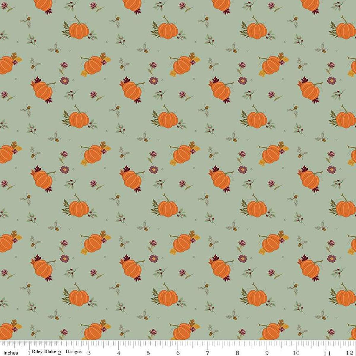 Image of the Awe of Autumn Pumpkins Hazy quilting cotton fabric by Riley Blake Designs. Features pumpkins on a green background. Cute Little Fabric Shop