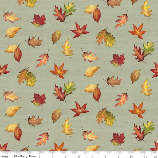 Image of the Covered Bridges in Fall Leaf Toss Sage quilting cotton fabric by Riley Blake Designs. Features leaves on a green background. Cute Little Fabric Shop