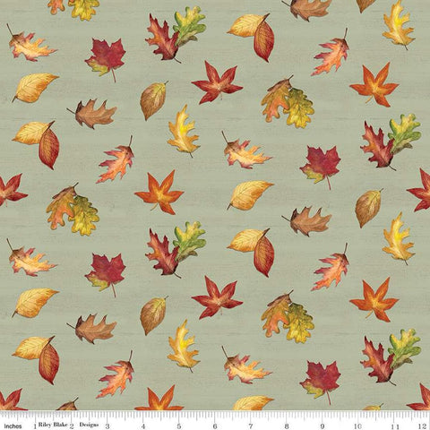 Image of the Covered Bridges in Fall Leaf Toss Sage quilting cotton fabric by Riley Blake Designs. Features leaves on a green background. Cute Little Fabric Shop
