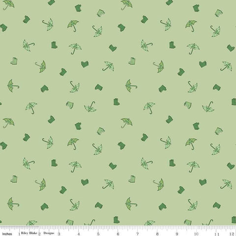 Image of the Cloudburst Umbrellas Green quilting cotton fabric by Riley Blake Designs. Features rainboots on a green background. Cute Little Fabric Shop