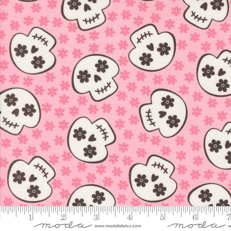 Image of the Fab Boo Lous Skull Pink Candy quilting cotton fabric. Features skulls on a pink background. Cute Little Fabric Shop