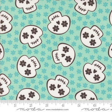 Image of the Fab Boo Lous Skull Aqua quilting cotton fabric. Features skulls on a blue background. Cute Little Fabric Shop