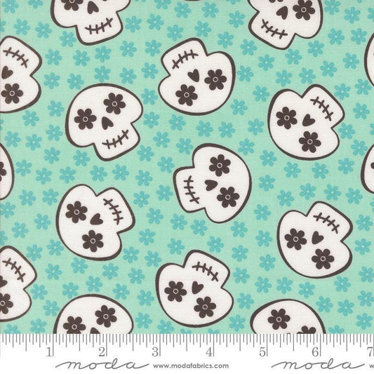 Image of the Fab Boo Lous Skull Aqua quilting cotton fabric. Features skulls on a blue background. Cute Little Fabric Shop