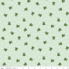 Image of the Mistletoe & Holly Mistle Scattered Bells Hint of Mint quilting cotton fabric by Riley Blake Designs. Features bells on a green background. Cute Little Fabric Shop