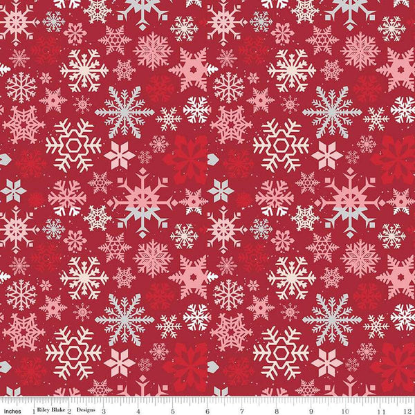 Image of the Mistletoe & Holly Snowflakes Barn Red quilting cotton fabric by Riley Blake Designs. Features snowflakes on a red background. Cute Little Fabric Shop