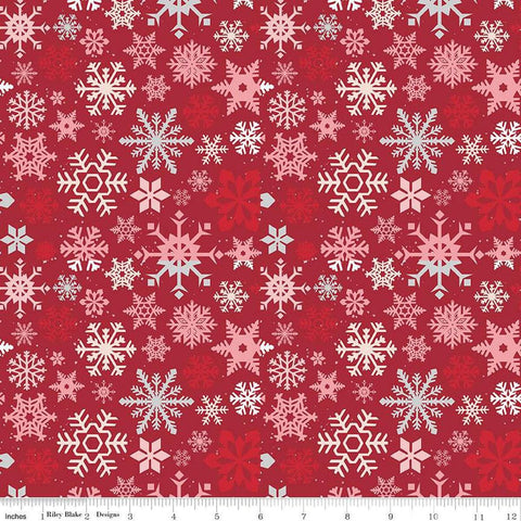 Image of the Mistletoe & Holly Snowflakes Barn Red quilting cotton fabric by Riley Blake Designs. Features snowflakes on a red background. Cute Little Fabric Shop