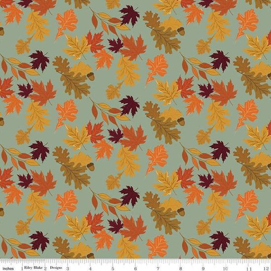 Image of the Awe of Autumn Leaves Hazy quilting cotton fabric by Riley Blake Designs. Features leaves on a green background. Cute Little Fabric Shop