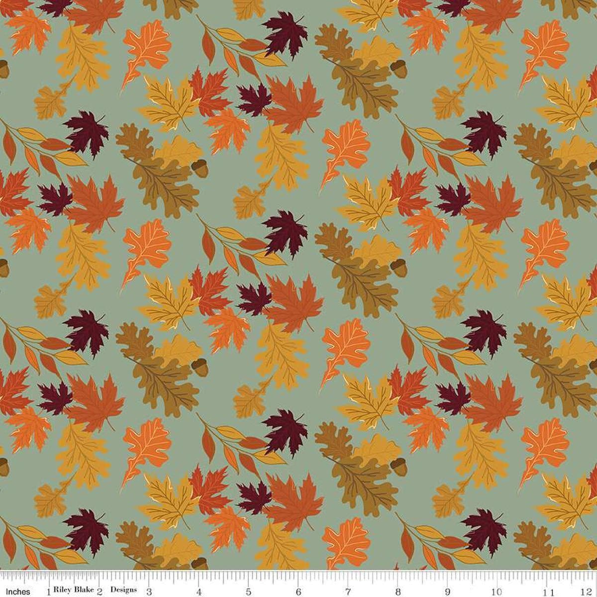 Image of the Awe of Autumn Leaves Hazy quilting cotton fabric by Riley Blake Designs. Features leaves on a green background. Cute Little Fabric Shop