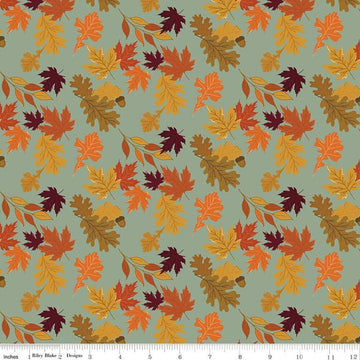 Image of the Awe of Autumn Leaves Hazy quilting cotton fabric by Riley Blake Designs. Features leaves on a green background. Cute Little Fabric Shop
