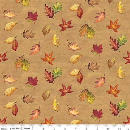 Image of the Covered Bridges in Fall Leaf Toss Gold quilting cotton fabric by Riley Blake Designs. Features leaves on a gold background. Cute Little Fabric Shop