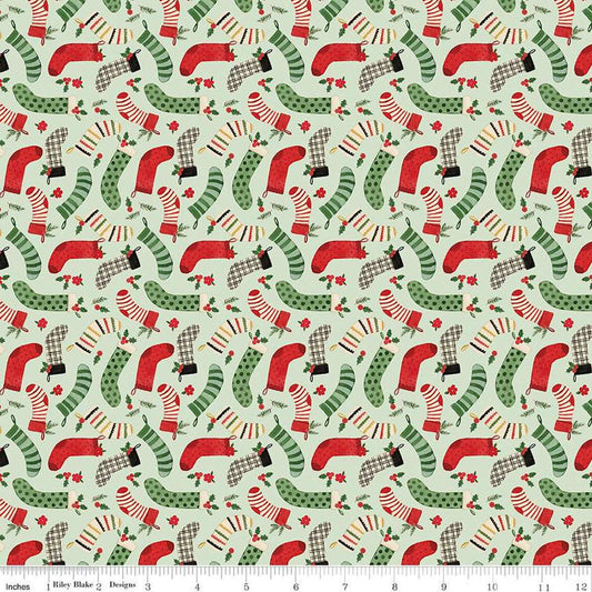 Image of the Charming Christmas Stockings Mint quilting cotton fabric by Riley Blake Designs. Features holidays on a green background. Cute Little Fabric Shop