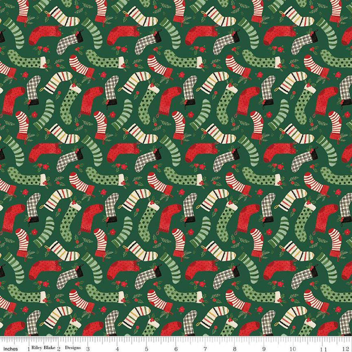 Image of the Charming Christmas Stockings Green quilting cotton fabric by Riley Blake Designs. Features holidays on a green background. Cute Little Fabric Shop