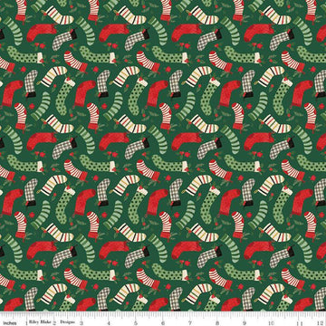 Image of the Charming Christmas Stockings Green quilting cotton fabric by Riley Blake Designs. Features holidays on a green background. Cute Little Fabric Shop