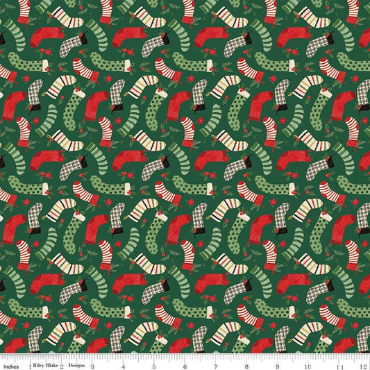 Image of the Charming Christmas Stockings Green quilting cotton fabric by Riley Blake Designs. Features holidays on a green background. Cute Little Fabric Shop