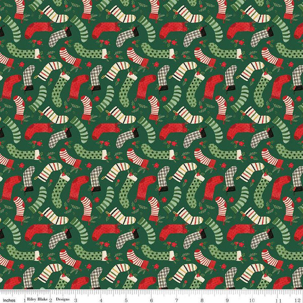 Image of the Charming Christmas Stockings Green quilting cotton fabric by Riley Blake Designs. Features holidays on a green background. Cute Little Fabric Shop
