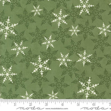 Image of the Winter Friends Woodland Pine quilting cotton fabric by Moda Fabrics. Features snowflakes on a green background. Cute Little Fabric Shop