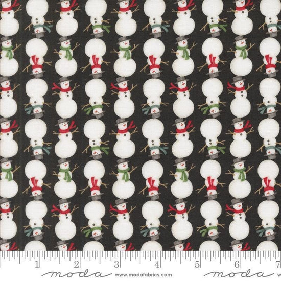 Image of the Winter Friends Snowmen Charcoal Black quilting cotton fabric by Moda Fabrics. Features snow men on a black background. Cute Little Fabric Shop