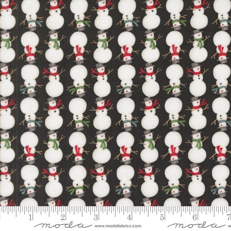 Image of the Winter Friends Snowmen Charcoal Black quilting cotton fabric by Moda Fabrics. Features snow men on a black background. Cute Little Fabric Shop