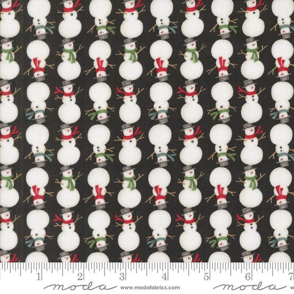 Image of the Winter Friends Snowmen Charcoal Black quilting cotton fabric by Moda Fabrics. Features snow men on a black background. Cute Little Fabric Shop