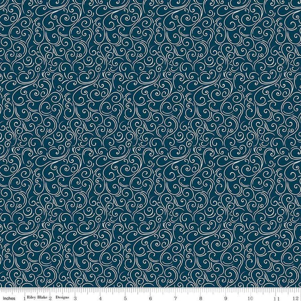 Image of the Winter Magic Swirls Navy quilting cotton fabric by Riley Blake Designs. Features swirls on a blue background. Cute Little Fabric Shop