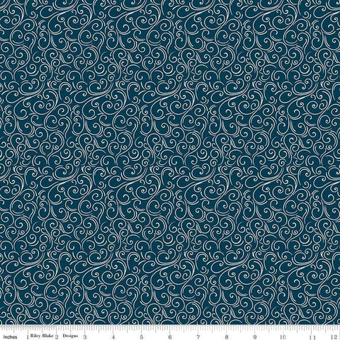 Image of the Winter Magic Swirls Navy quilting cotton fabric by Riley Blake Designs. Features swirls on a blue background. Cute Little Fabric Shop