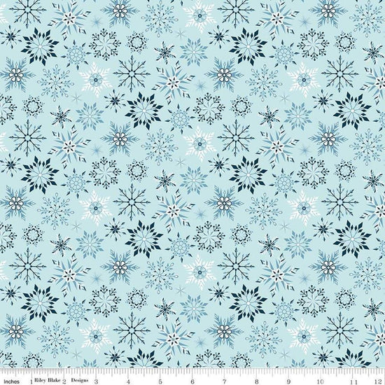 Image of the Winter Magic Snowflakes Aqua quilting cotton fabric by Riley Blake Designs. Features snowflakes on a blue background. Cute Little Fabric Shop