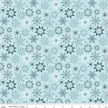 Image of the Winter Magic Snowflakes Aqua quilting cotton fabric by Riley Blake Designs. Features snowflakes on a blue background. Cute Little Fabric Shop