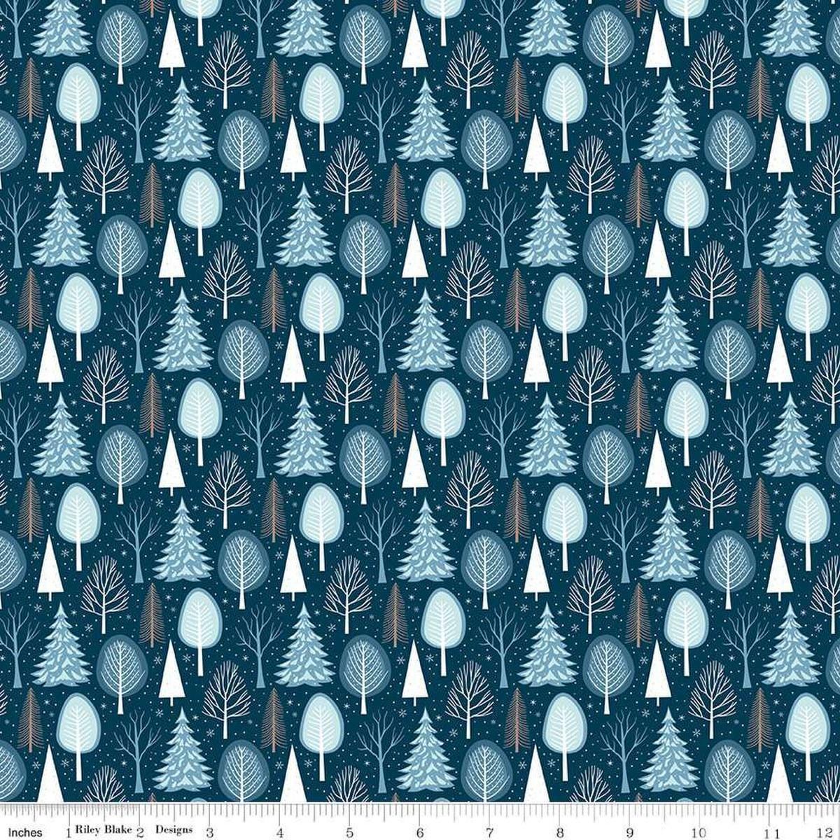 Image of the Winter Magic Trees Blue quilting cotton fabric by Riley Blake Designs. Features trees on a blue background. Cute Little Fabric Shop