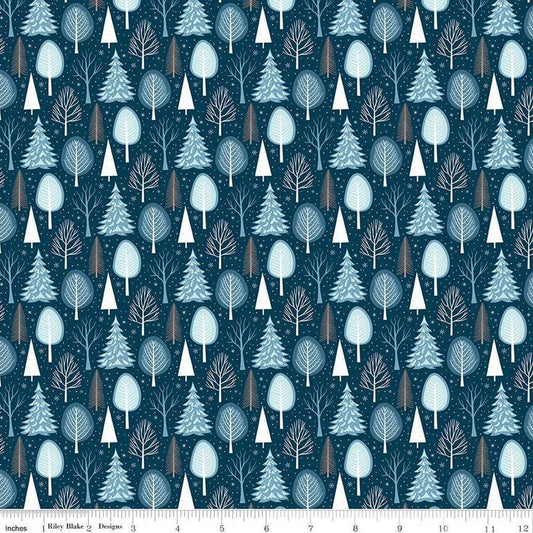 Image of the Winter Magic Trees Blue quilting cotton fabric by Riley Blake Designs. Features trees on a blue background. Cute Little Fabric Shop