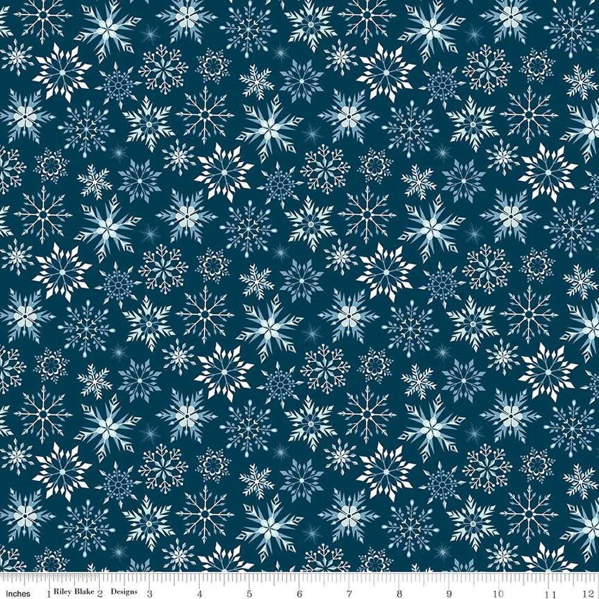 Image of the Winter Magic Snowflakes Navy quilting cotton fabric by Riley Blake Designs. Features snowflakes on a blue background. Cute Little Fabric Shop