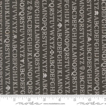 Image of the Agatha Road Alphabet Midnight quilting cotton fabric by Moda Fabrics. Features letters on a black background. Cute Little Fabric Shop