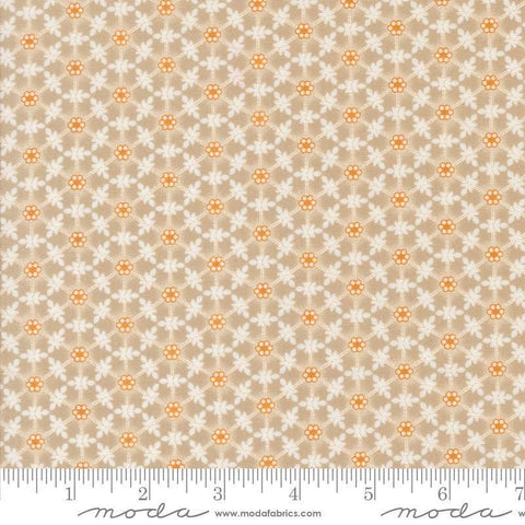 Image of the Agatha Road Wreaths Smoke quilting cotton fabric by Moda Fabrics. Features flowers on a brown background. Cute Little Fabric Shop