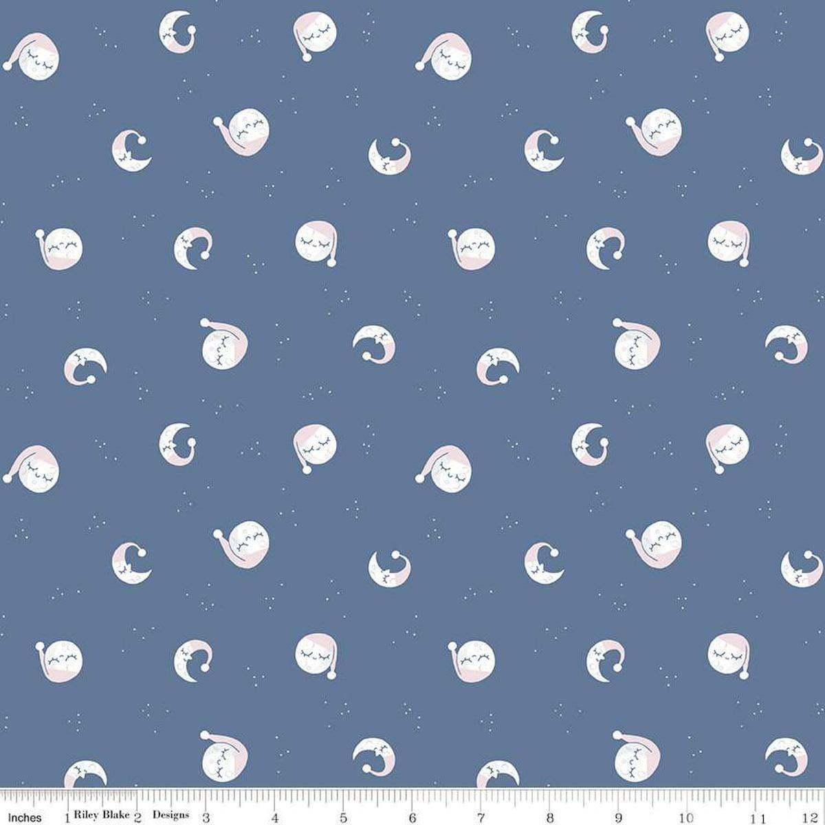 Image of the Twinkle Little Star Goodnight Moon Denim quilting cotton fabric by Riley Blake Designs. Features stars on a blue background. Cute Little Fabric Shop