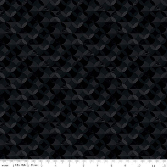 Image of the New Box of Crayons Kaleidoscope Black Quilting Cotton Fabric by Riley Blake Designs. Features orange peel on a black background. Cute Little Fabric Shop