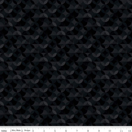 Image of the New Box of Crayons Kaleidoscope Black Quilting Cotton Fabric by Riley Blake Designs. Features orange peel on a black background. Cute Little Fabric Shop