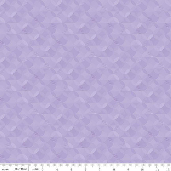 Image of the New Box of Crayons Kaleidoscope Purple Quilting Cotton Fabric by Riley Blake Designs. Features orange peel on a purple background. Cute Little Fabric Shop