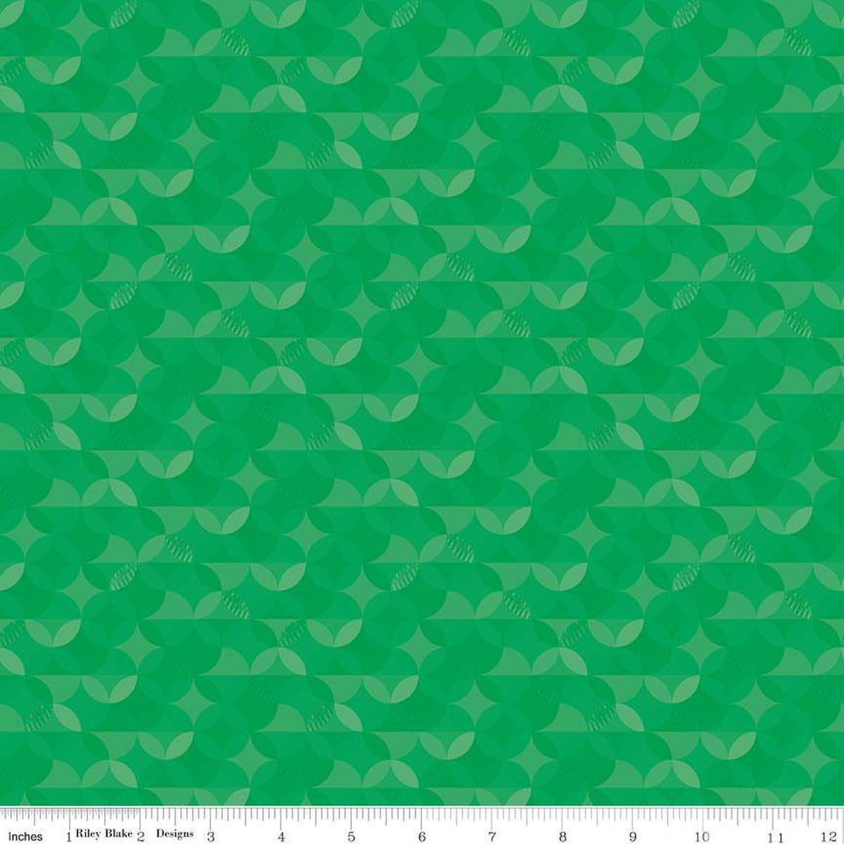 Image of the New Box of Crayons Kaleidoscope Green Quilting Cotton Fabric by Riley Blake Designs. Features orange peel on a green background. Cute Little Fabric Shop