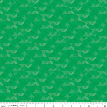 Image of the New Box of Crayons Kaleidoscope Green Quilting Cotton Fabric by Riley Blake Designs. Features orange peel on a green background. Cute Little Fabric Shop