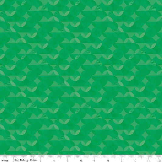 Image of the New Box of Crayons Kaleidoscope Green Quilting Cotton Fabric by Riley Blake Designs. Features orange peel on a green background. Cute Little Fabric Shop