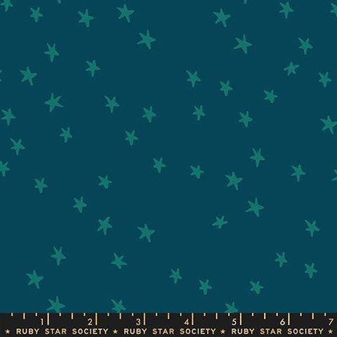 Image of the Starry New Blender Stars Galaxy quilting cotton fabric by Ruby Star Society for Moda Fabrics. Features small stars on a blue background. Cute Little Fabric Shop