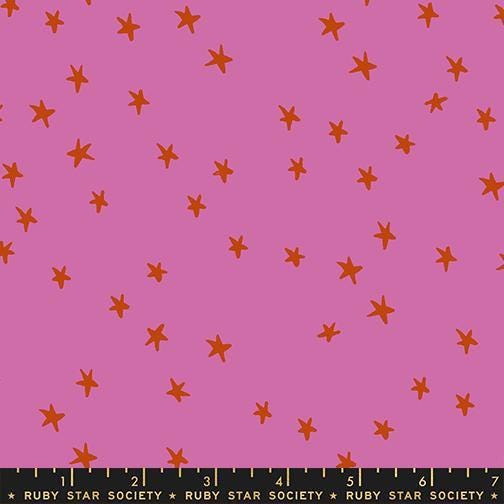 Image of the Starry New Blender Stars Heliotrope quilting cotton fabric by Ruby Star Society for Moda Fabrics. Features small stars on a pink background. Cute Little Fabric Shop