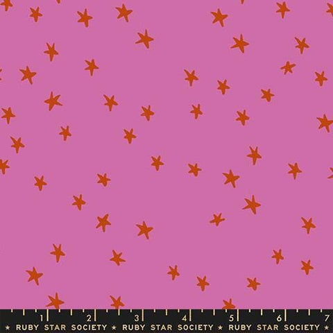 Image of the Starry New Blender Stars Heliotrope quilting cotton fabric by Ruby Star Society for Moda Fabrics. Features small stars on a pink background. Cute Little Fabric Shop