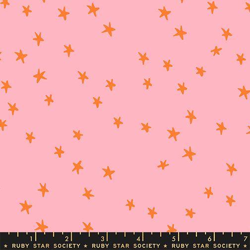 Image of the Starry New Blender Stars Rosebud quilting cotton fabric by Ruby Star Society for Moda Fabrics. Features small stars on a pink background. Cute Little Fabric Shop