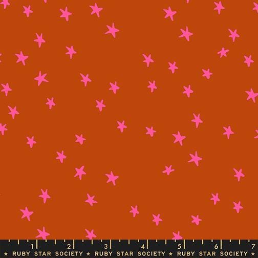 Image of the Starry New Blender Stars Cayenne quilting cotton fabric by Ruby Star Society for Moda Fabrics. Features small stars on a orange background. Cute Little Fabric Shop