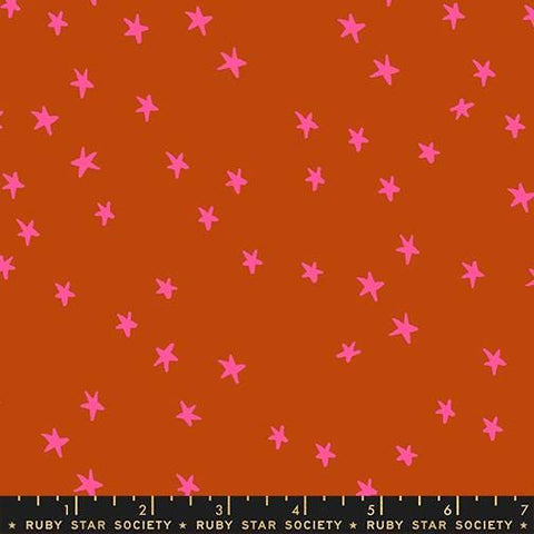 Image of the Starry New Blender Stars Cayenne quilting cotton fabric by Ruby Star Society for Moda Fabrics. Features small stars on a orange background. Cute Little Fabric Shop
