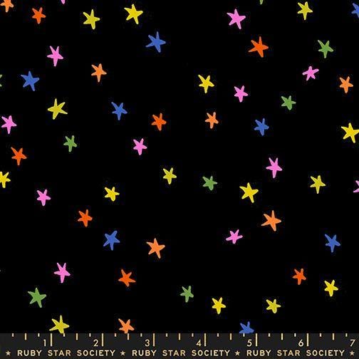 Image of the Starry New Blender Stars Vivid Rainbow quilting cotton fabric by Ruby Star Society for Moda Fabrics. Features small stars on a black background. Cute Little Fabric Shop