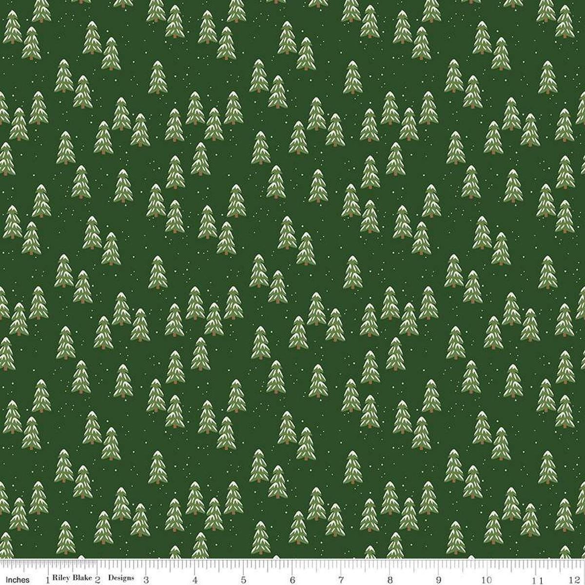 Image of the More Christmas Wishes Pines Forest quilting cotton fabric by Riley Blake Designs. Features pines on a green background. Cute Little Fabric Shop